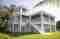 Modern Florida home with exterior staircase painted by Pelican Painting Company